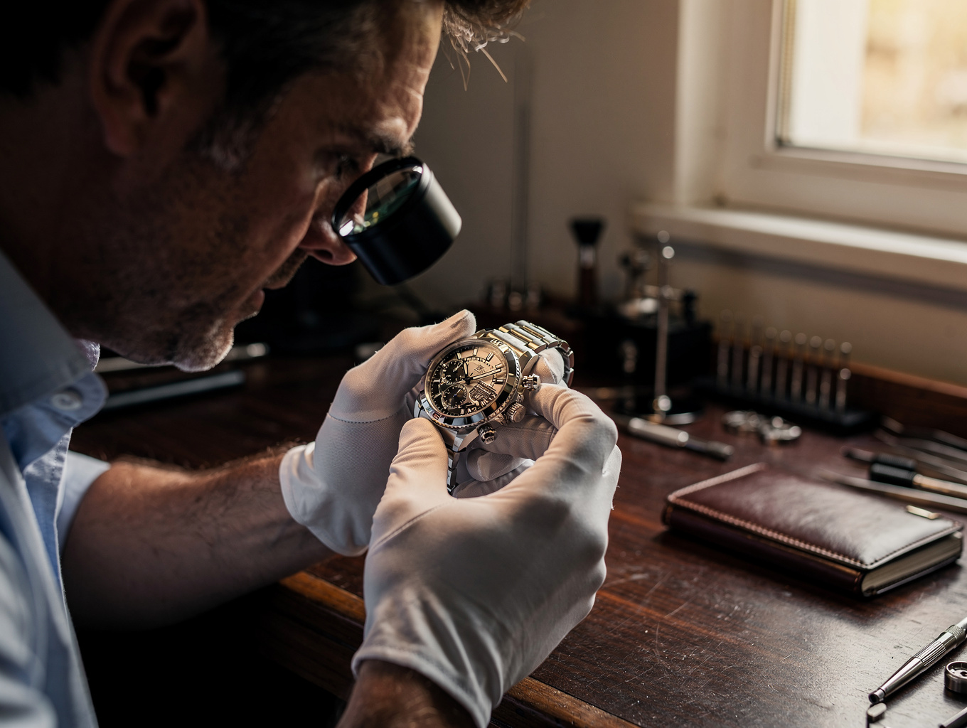 Professional luxury watch valuation in a high-end studio setting